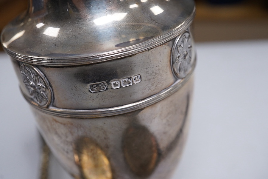 A George V silver sugar caster, by Harrod's Ltd, Sheffield, 1912, 18.4cm and a pair of Victorian commemorative spoons, Edward Pairpoint, London, 1878. Condition - fair to good.